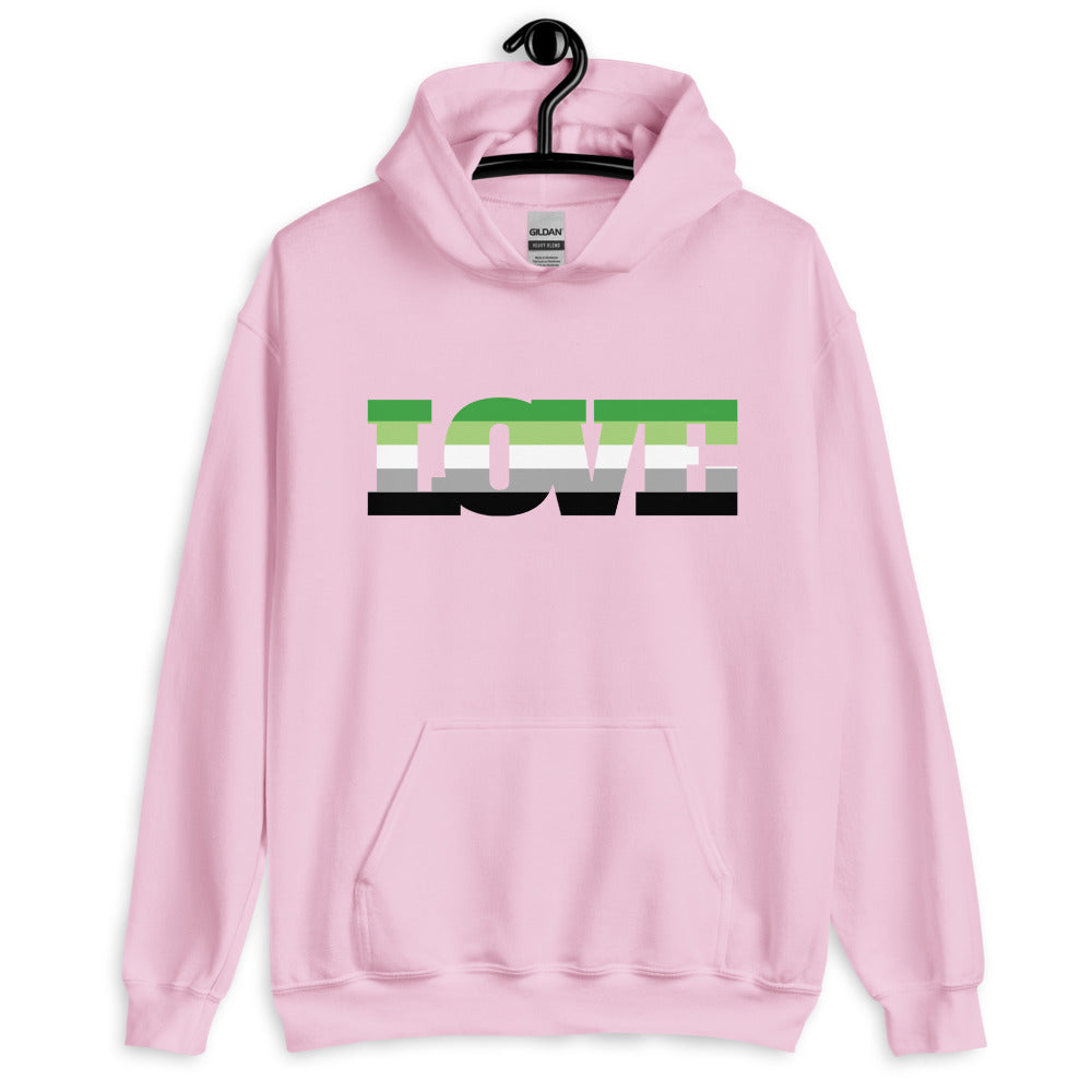Front view of a light pink hoodie on a hanger with multicolor LOVE lettering