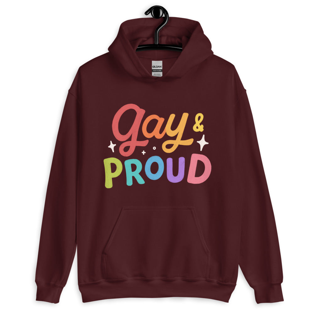 Front view of a maroon pullover hoodie reading “Gay & Proud” in rainbow-colored letters