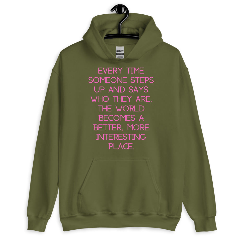 Front-view olive green hoodie with pink text reading “Every time someone steps up...”