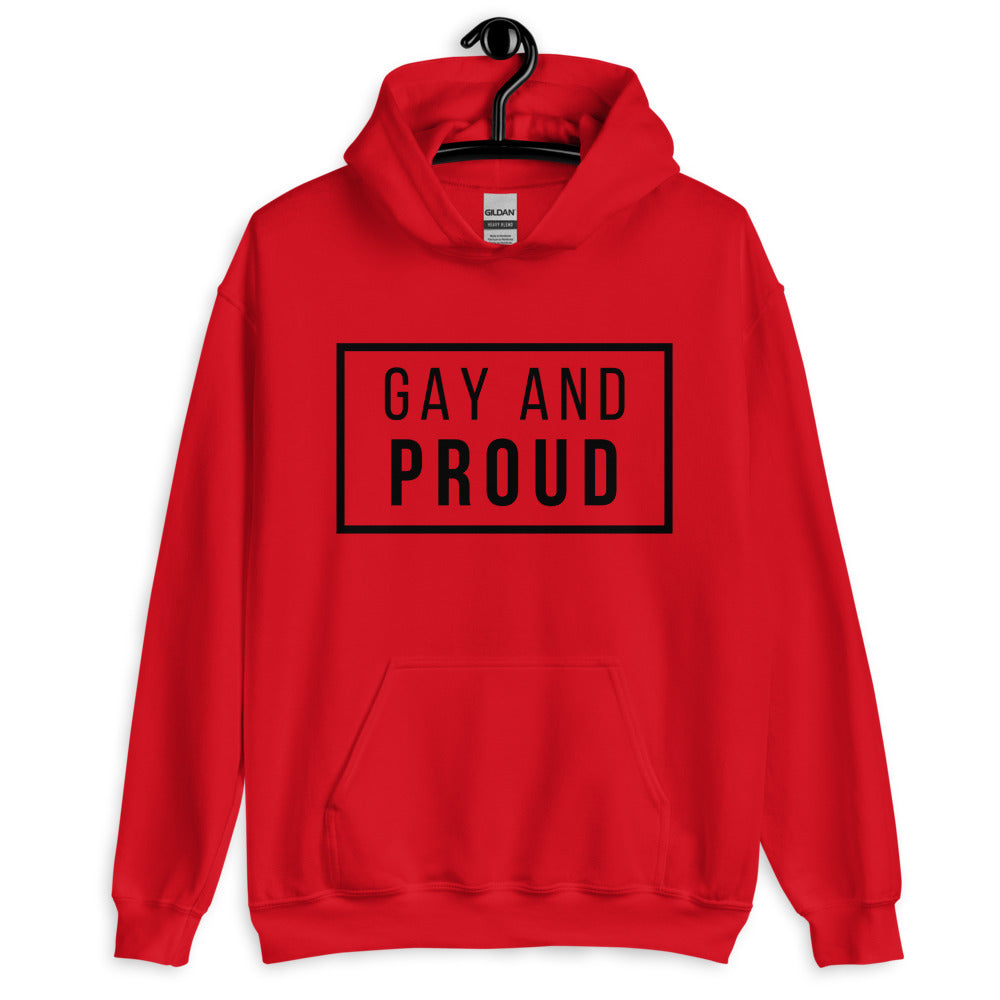 Front-view red hoodie on a hanger with a black-bordered “GAY AND PROUD” chest print