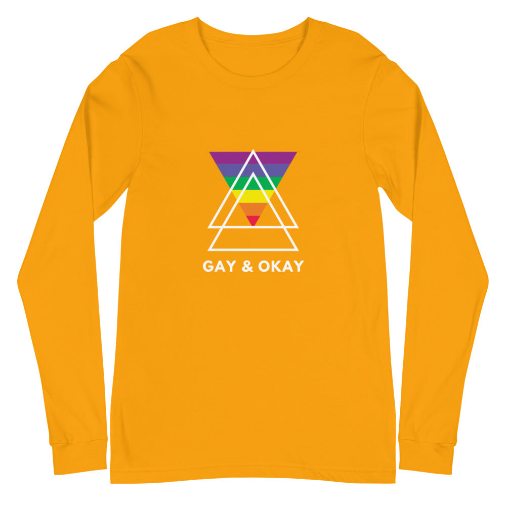 Gay & Ok Unisex Long Sleeve T-Shirt in bright yellow with a rainbow triangle and "Gay & Okay" slogan, worn by a smiling drag queen.