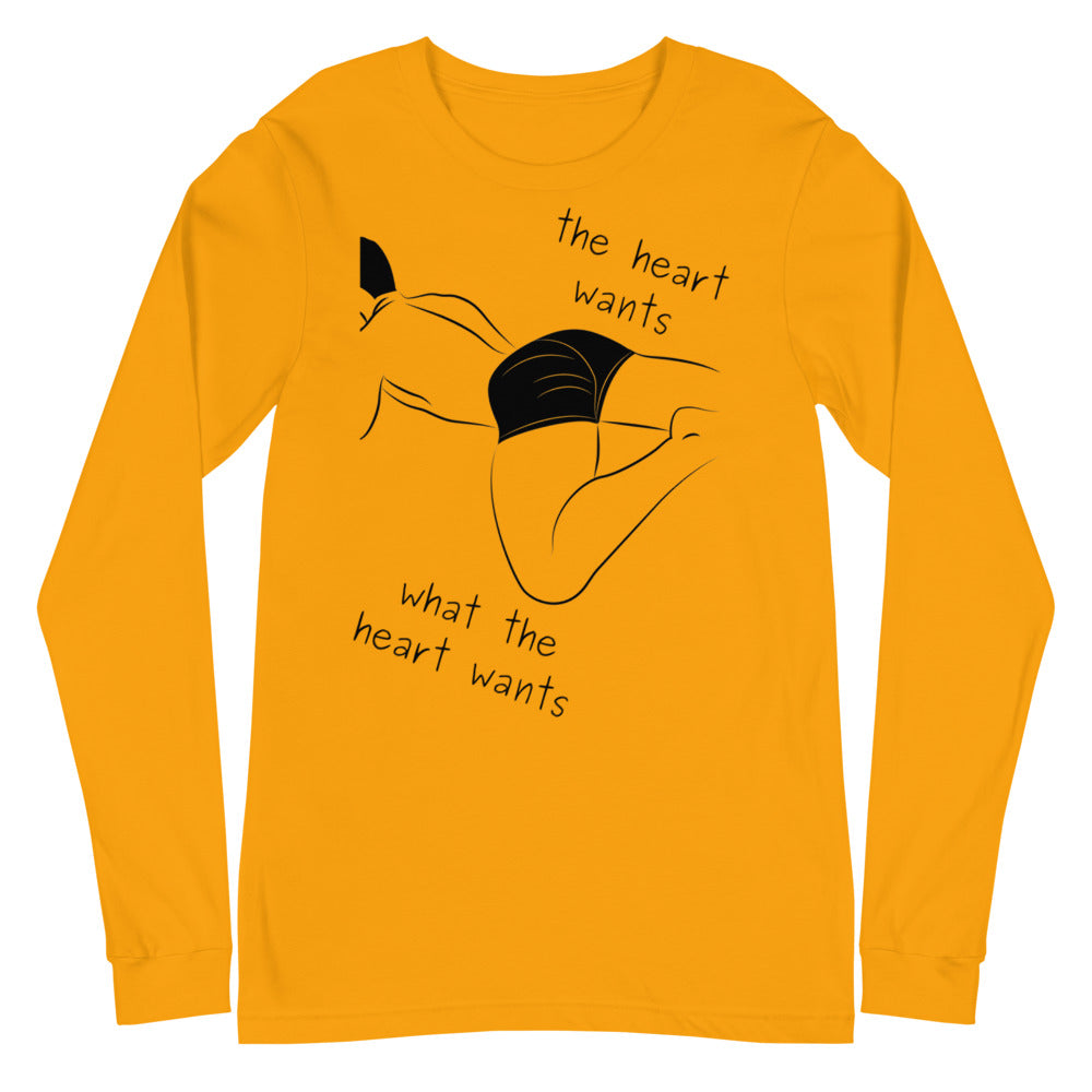 Front view of a mustard-yellow long-sleeve shirt with black line art and “The heart wants what the heart wants” text