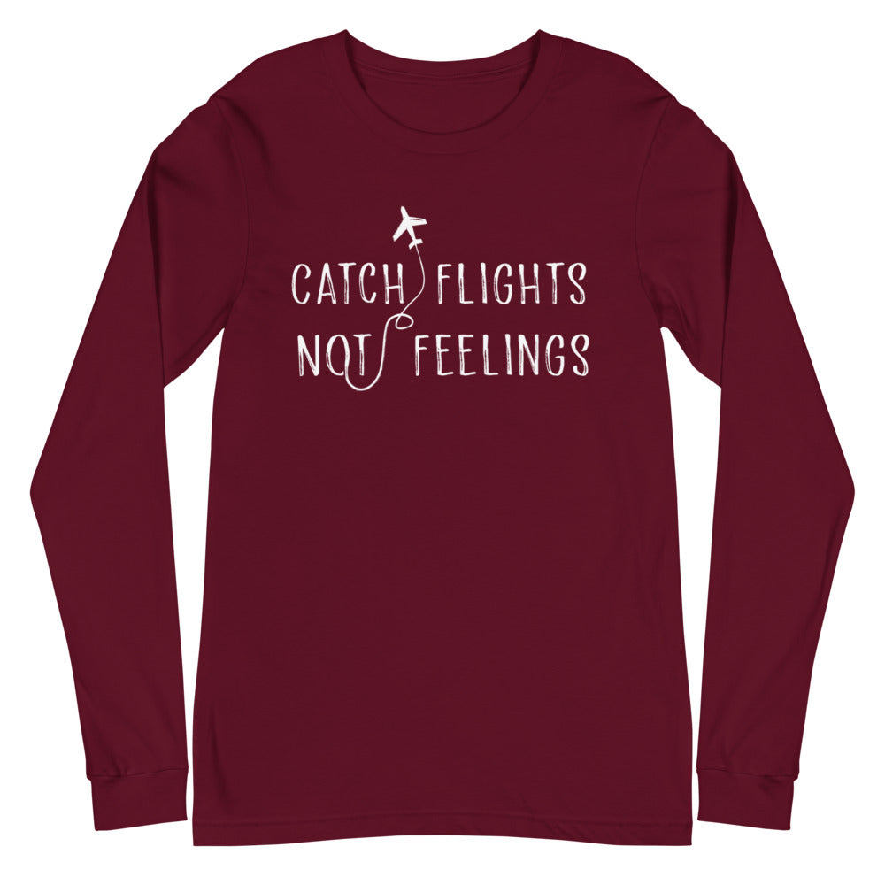 Burgundy long-sleeve shirt with white airplane graphic and “CATCH FLIGHTS NOT FEELINGS” text