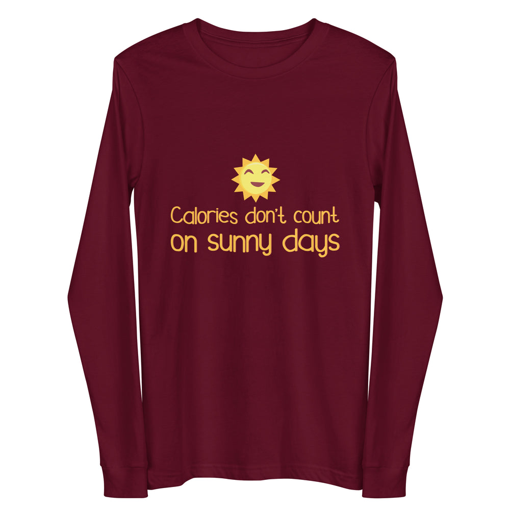 Front view of a maroon long-sleeve shirt with a smiling sun and “Calories don’t count on sunny days”
