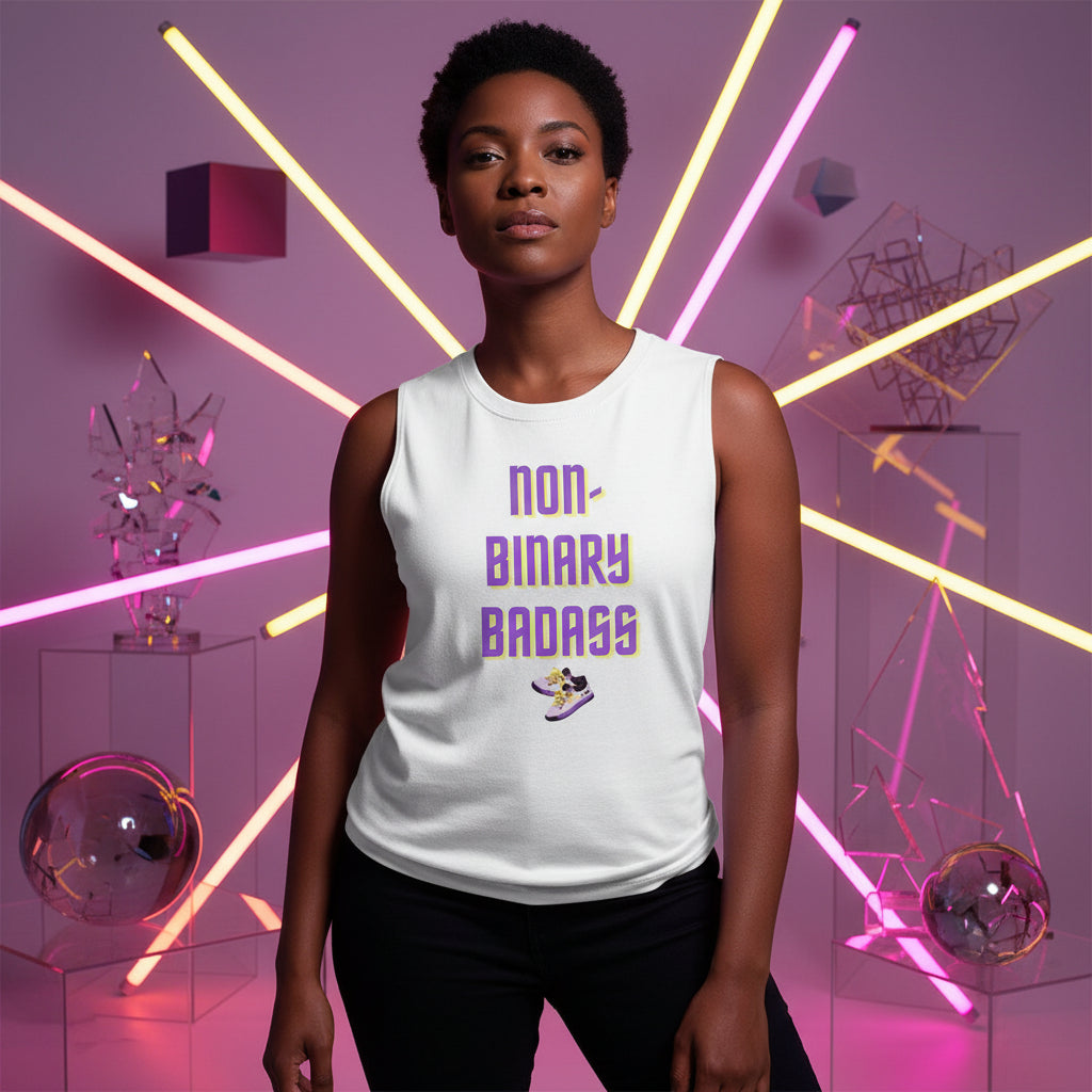 Model wearing a white muscle tank reading “NON-BINARY BADASS” with a sneaker graphic