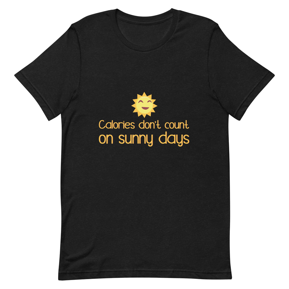 Front view of a black T-shirt reading “Calories don’t count on sunny days,” with a smiling sun graphic