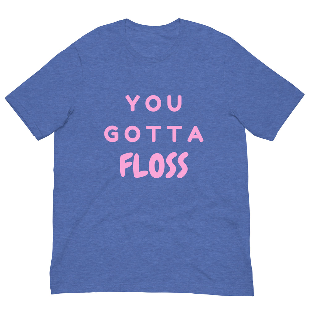 Front view of a heather-blue T-shirt with pink lettering reading “YOU GOTTA FLOSS.”
