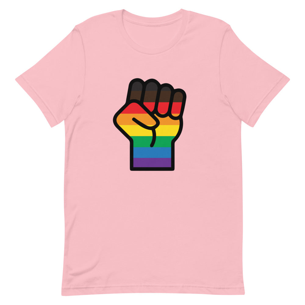 Front view of a pink T-shirt with a raised fist in rainbow Pride colors