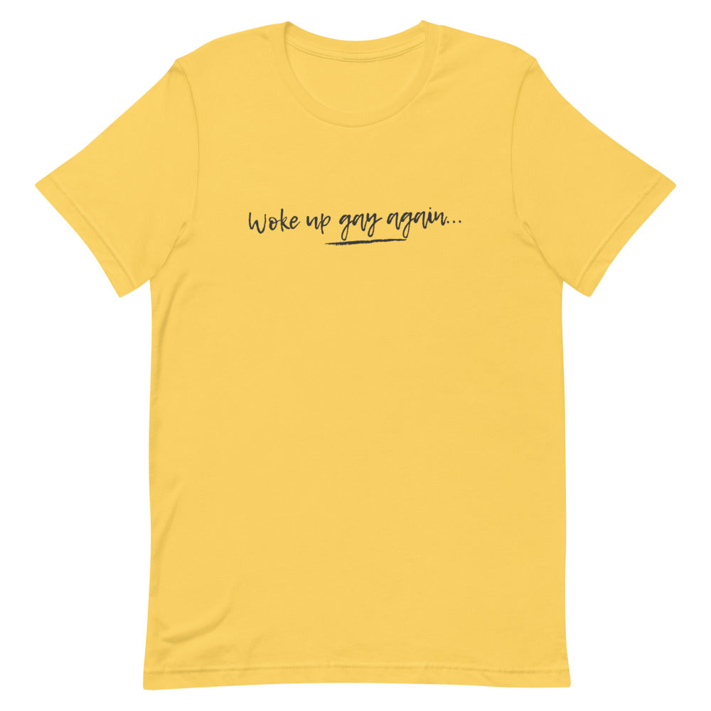 Yellow T-shirt with handwritten-style “woke up gay again...” slogan in black