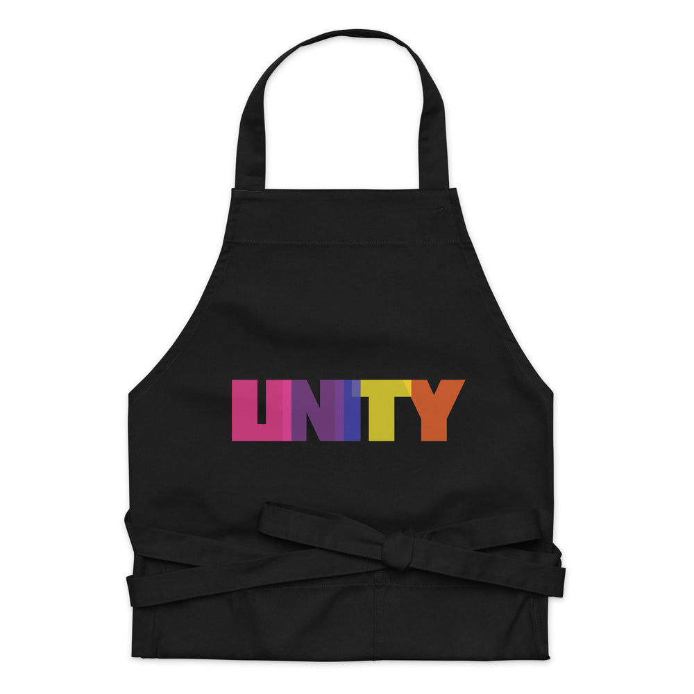 Front view of a black apron with a multicolored “UNITY” graphic and tied waist straps