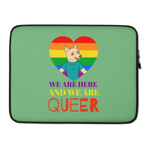 Front view of a green laptop sleeve with a rainbow heart and wolf, reading “WE ARE HERE AND WE ARE QUEER.”
