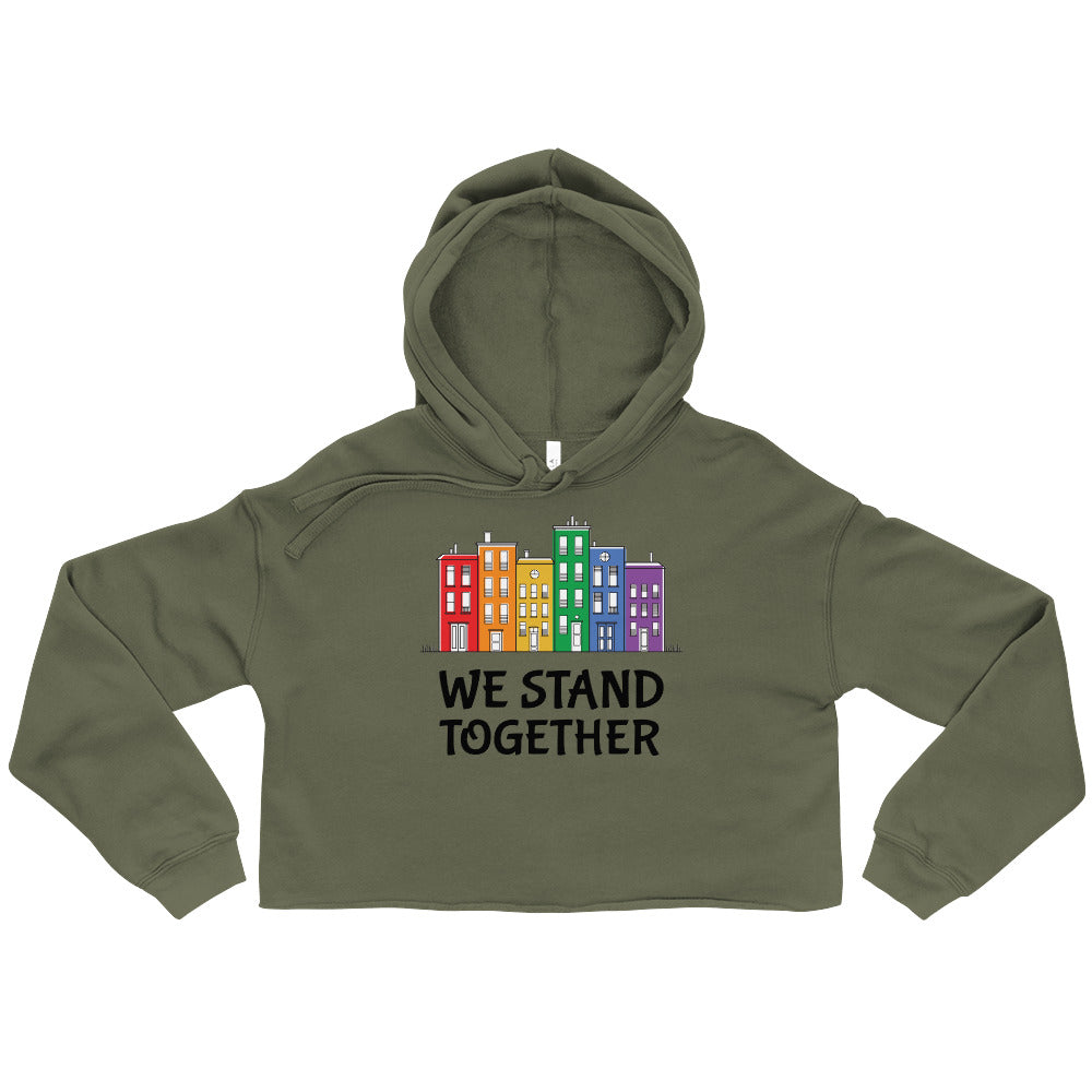 Military green cropped hoodie with a colorful row of buildings and “WE STAND TOGETHER” text