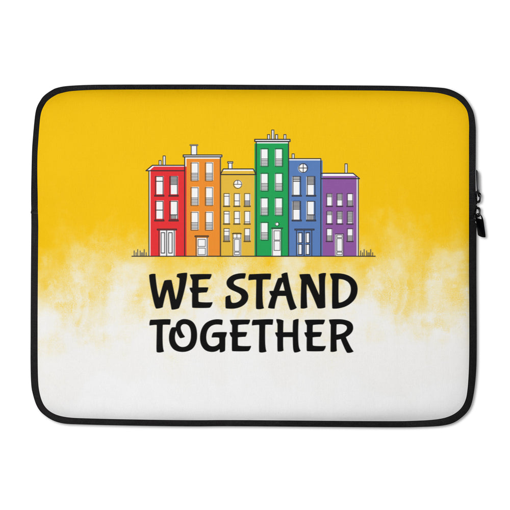 Laptop sleeve with colorful row houses and the words “WE STAND TOGETHER”