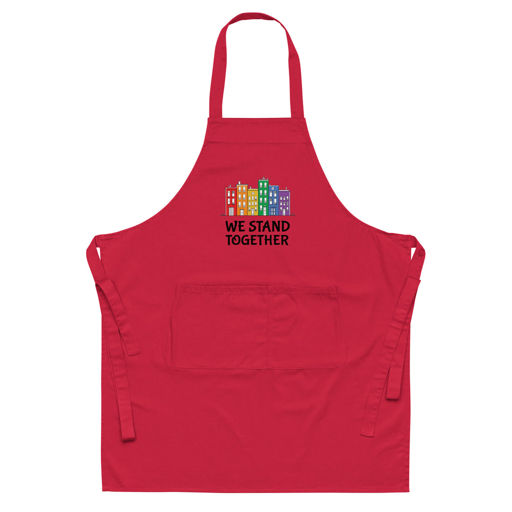 Front view of a red apron with colorful buildings and “WE STAND TOGETHER” text