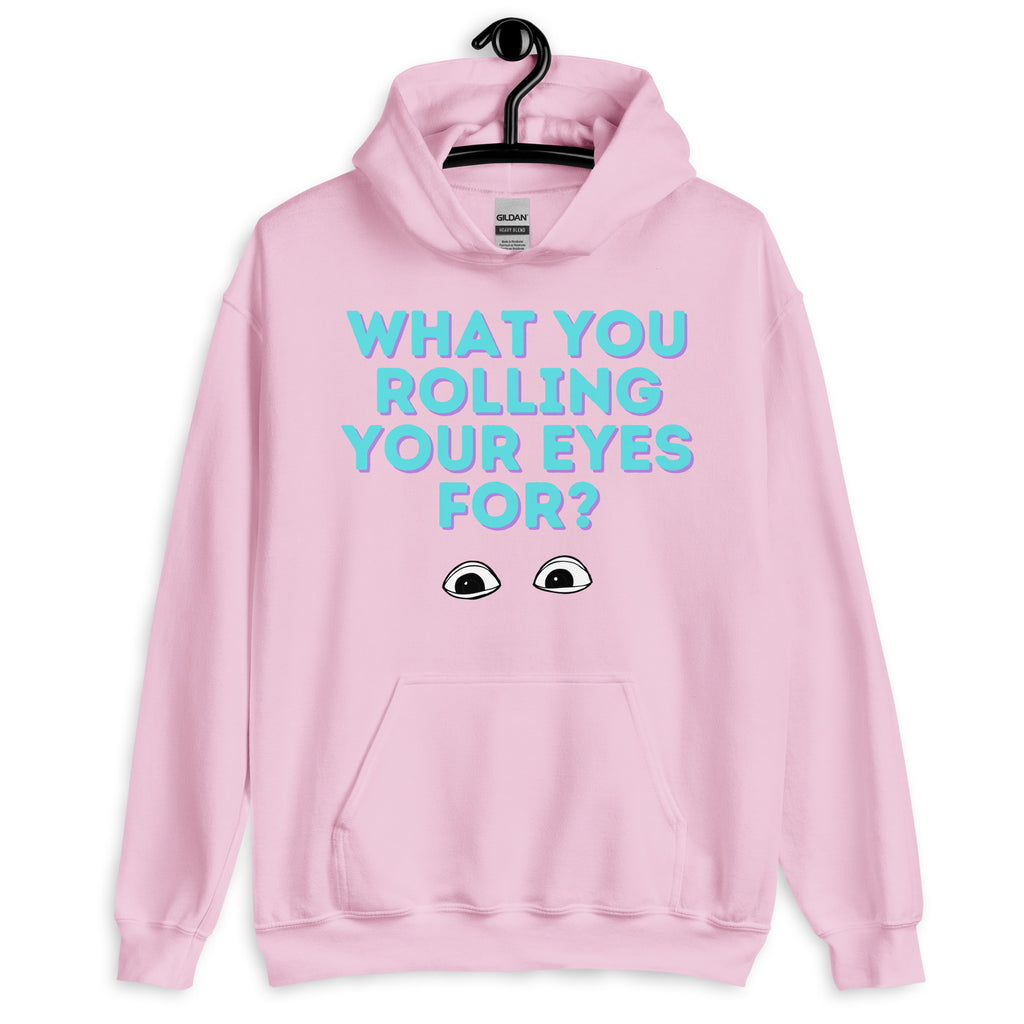Front view of a pink hoodie reading “WHAT YOU ROLLING YOUR EYES FOR?” with eye graphics