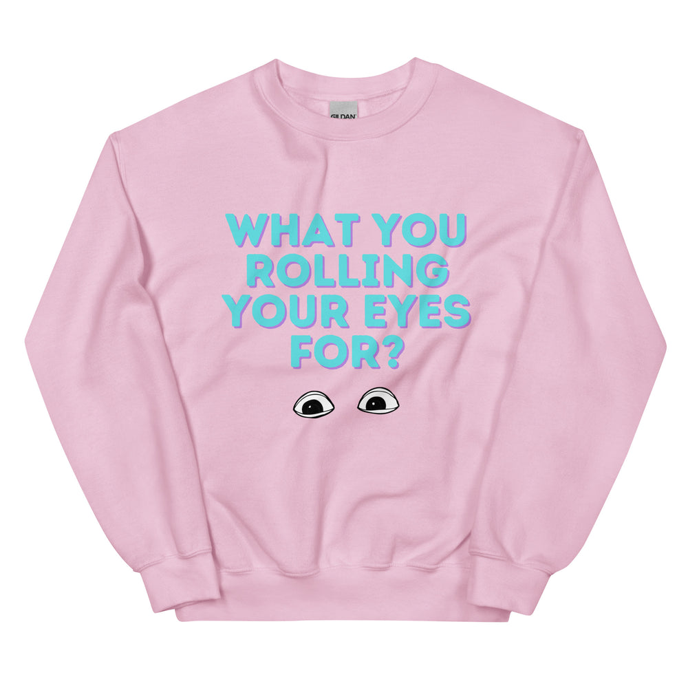 Front view of a pink sweatshirt reading “WHAT YOU ROLLING YOUR EYES FOR?” with cartoon eyes