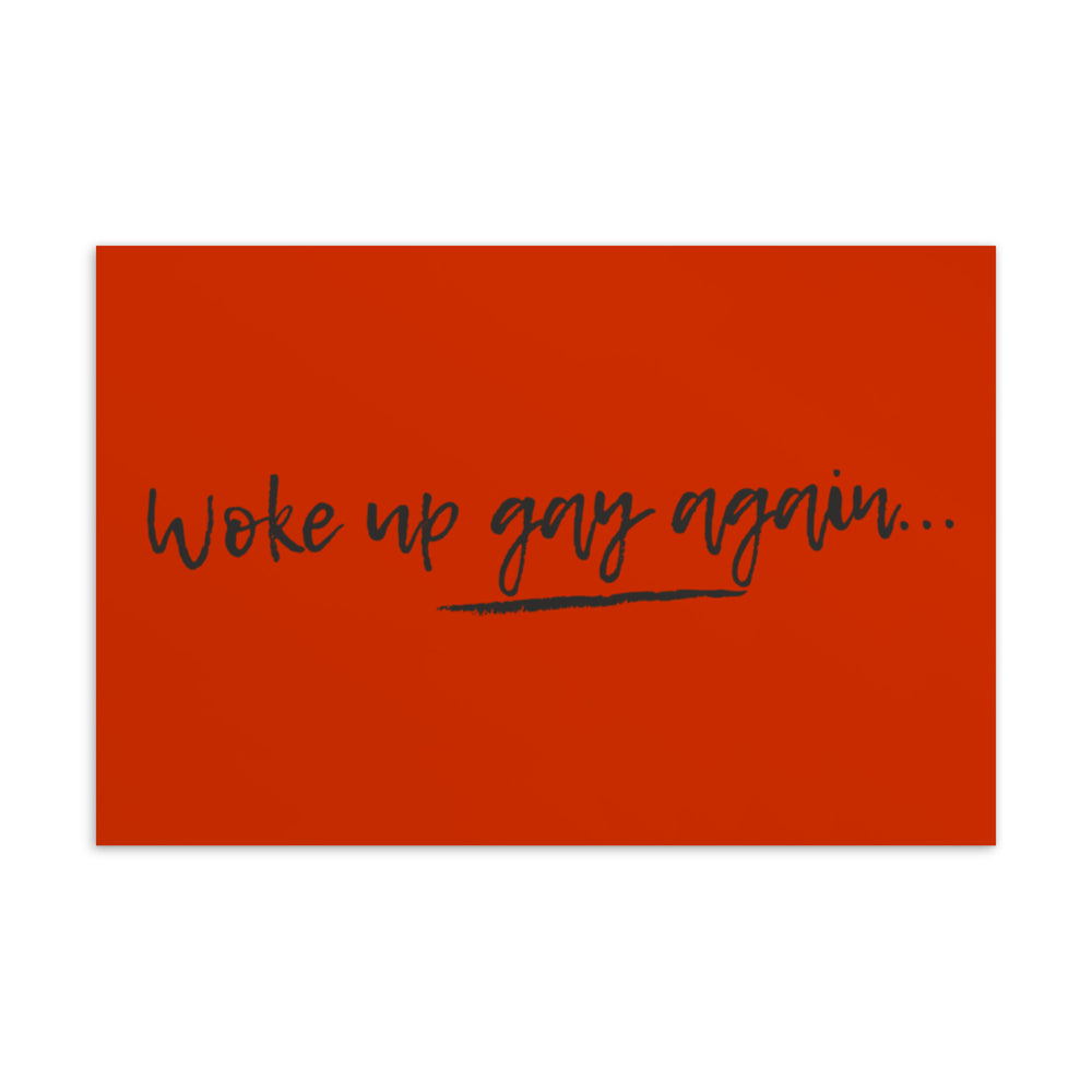 Red postcard with black handwritten text, “Woke up gay again...” and an underline