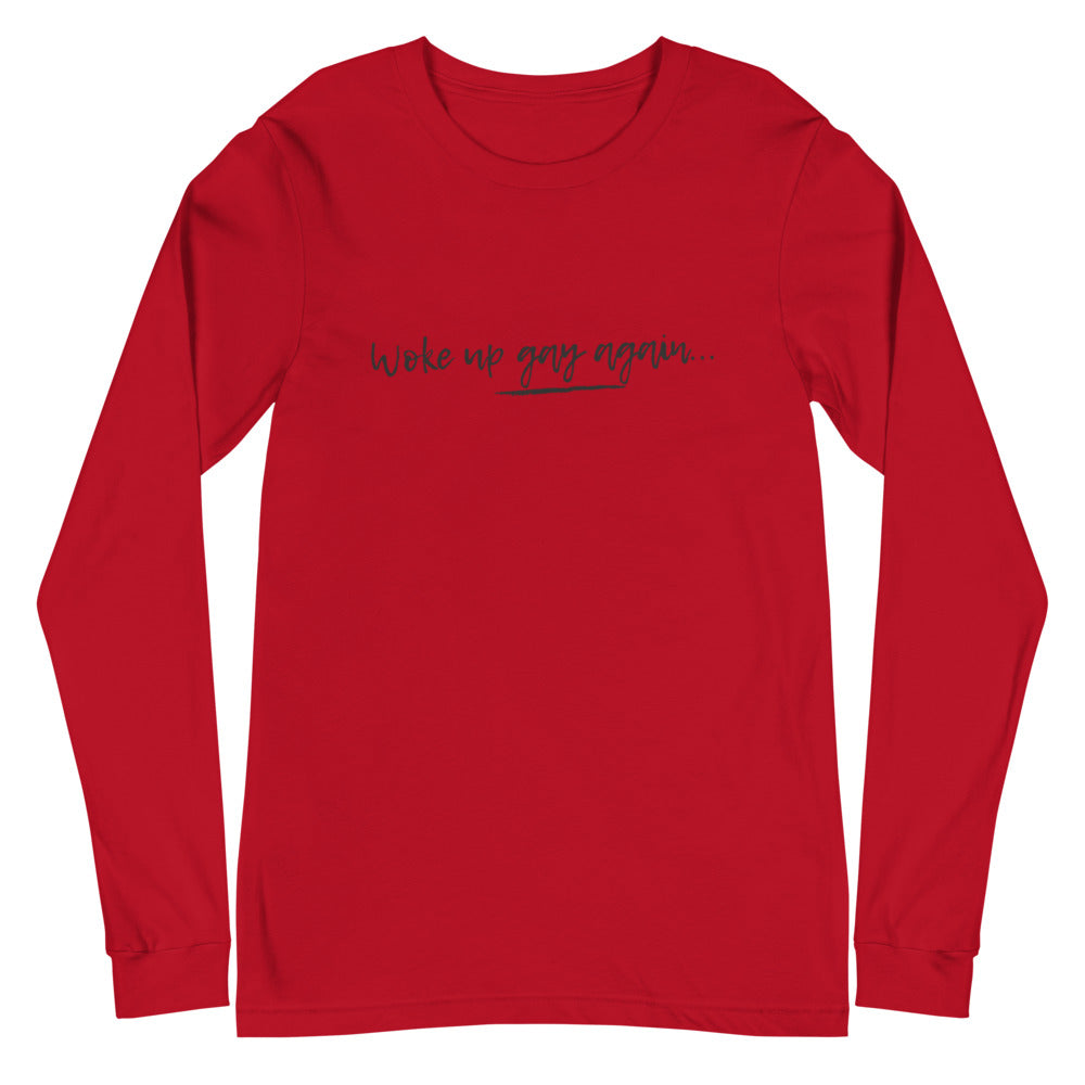Front view of a red long-sleeve shirt reading “Woke up gay again...”