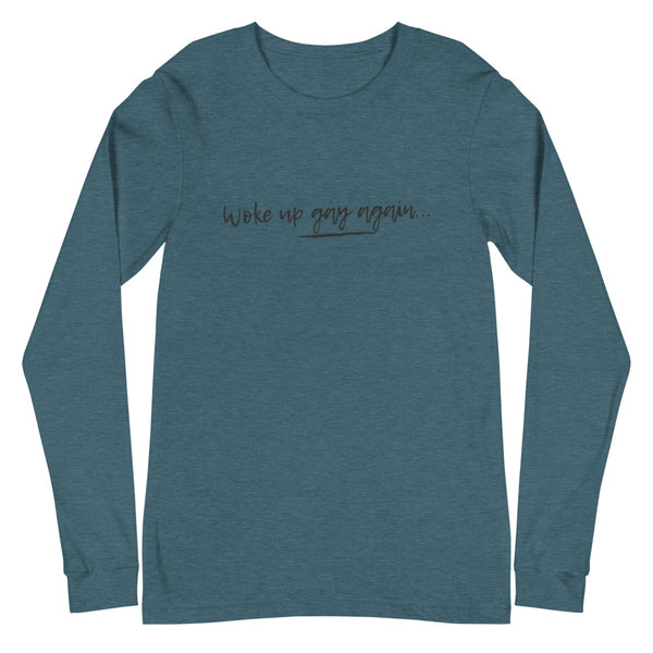 Heather teal long-sleeve shirt with centered text reading “Woke up gay again...”