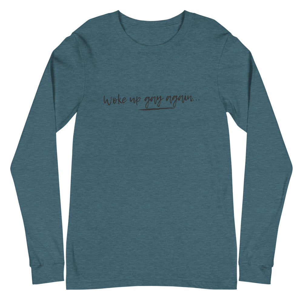 Heather teal long-sleeve shirt with centered text reading “Woke up gay again...”