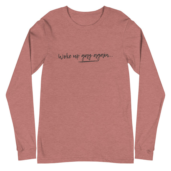 Heather mauve long-sleeve shirt reading “Woke up gay again…” in black script