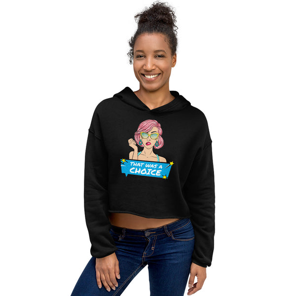 Model wearing a black cropped hoodie with a colorful person graphic and “THAT WAS A CHOICE” text