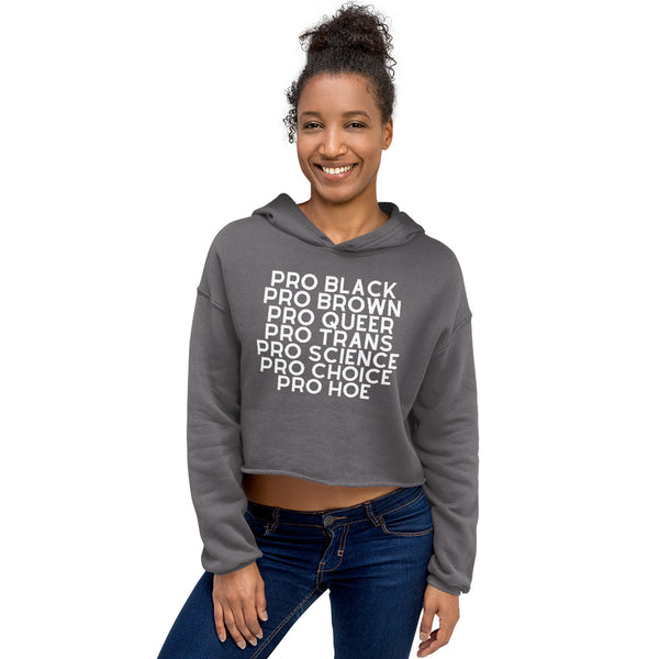 Model wearing a gray cropped hoodie reading “PRO BLACK PRO BROWN PRO QUEER PRO TRANS PRO SCIENCE PRO CHOICE PRO HOE”