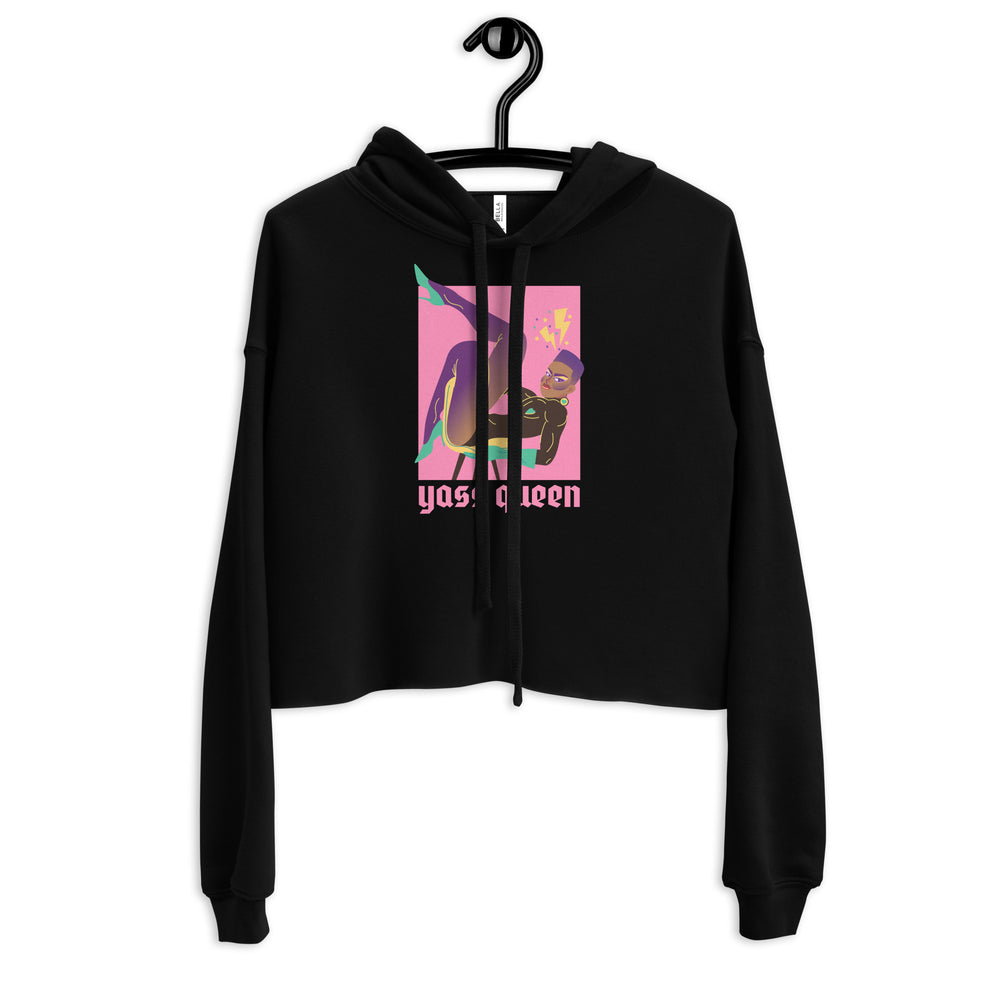 Front view of a black cropped hoodie on a hanger with a colorful queen graphic and “Yass Queen” text