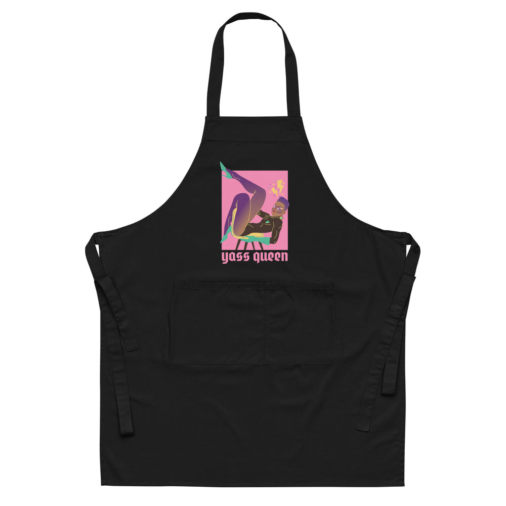 Front view of a black apron with a colorful graphic and “yass queen” text