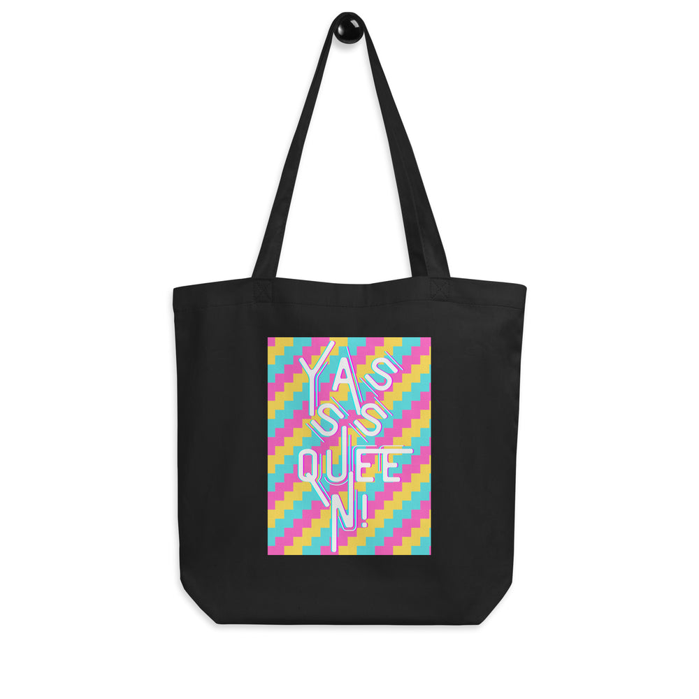 Front view of a black tote bag with a colorful panel reading “YASS QUEEN!”