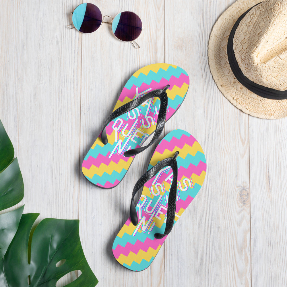 Yasss Queen flip-flops with black straps, colorful zigzag soles, and “Yasss Queen!” lettering