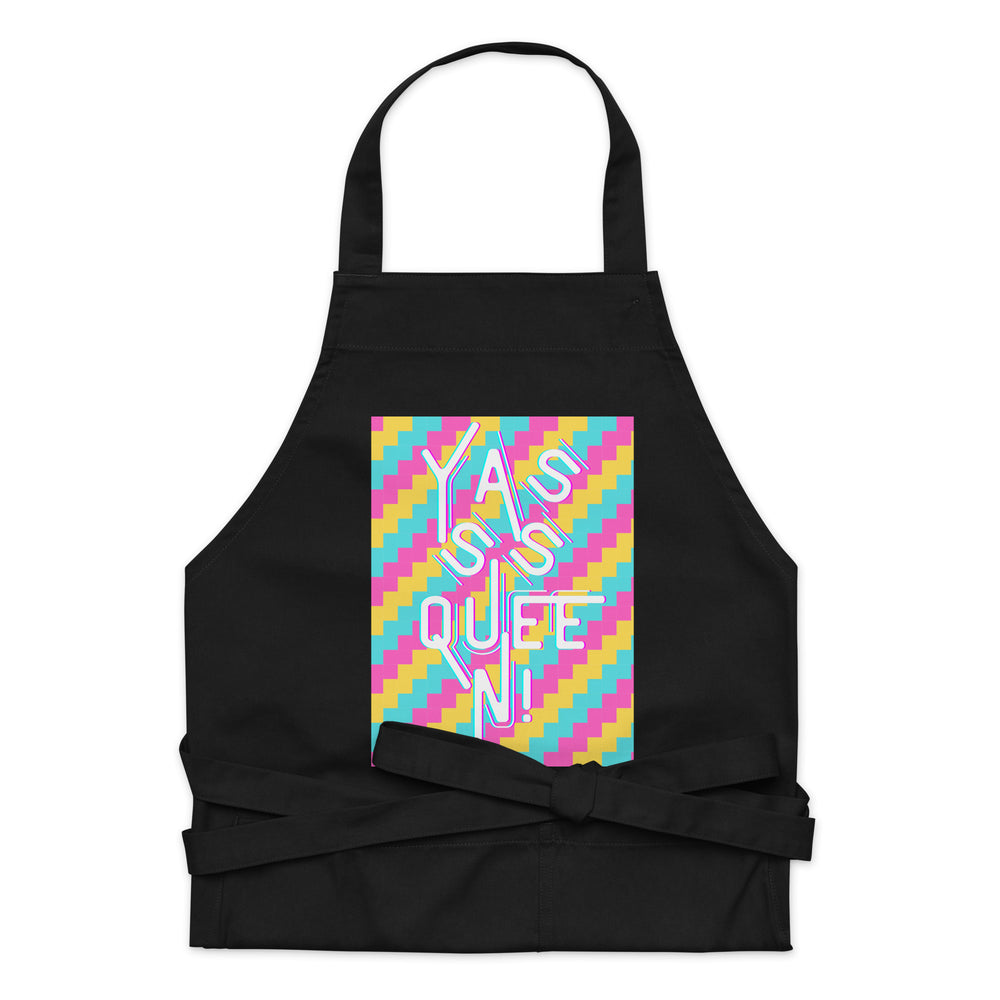 Front-facing black apron with a colorful panel reading “YASS QUEEN!”