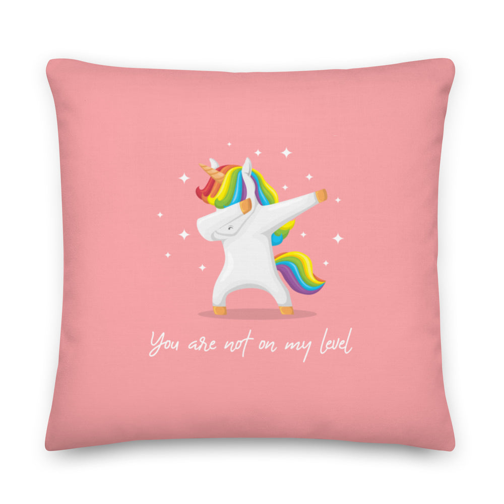 Pink square pillow with a rainbow-maned unicorn and the words “You are not on my level.”