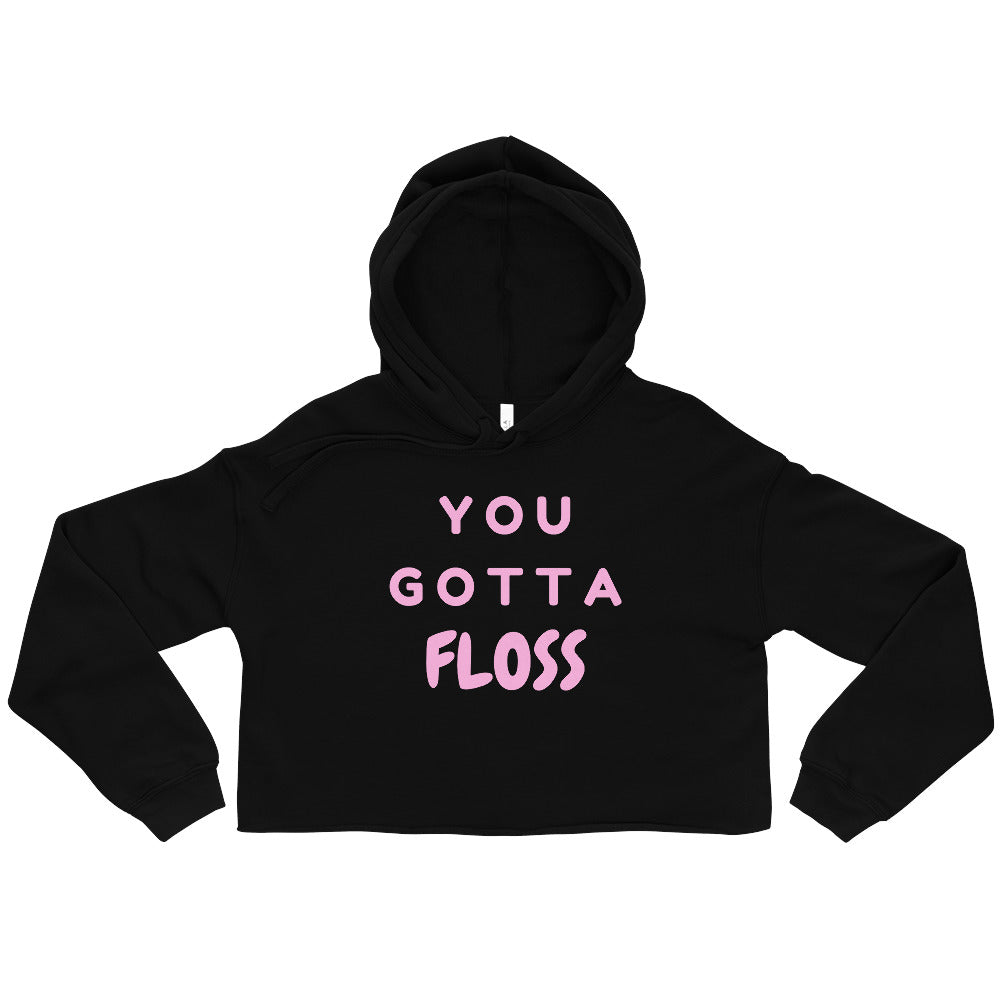 Front-facing black cropped hoodie with pink “YOU GOTTA FLOSS” lettering