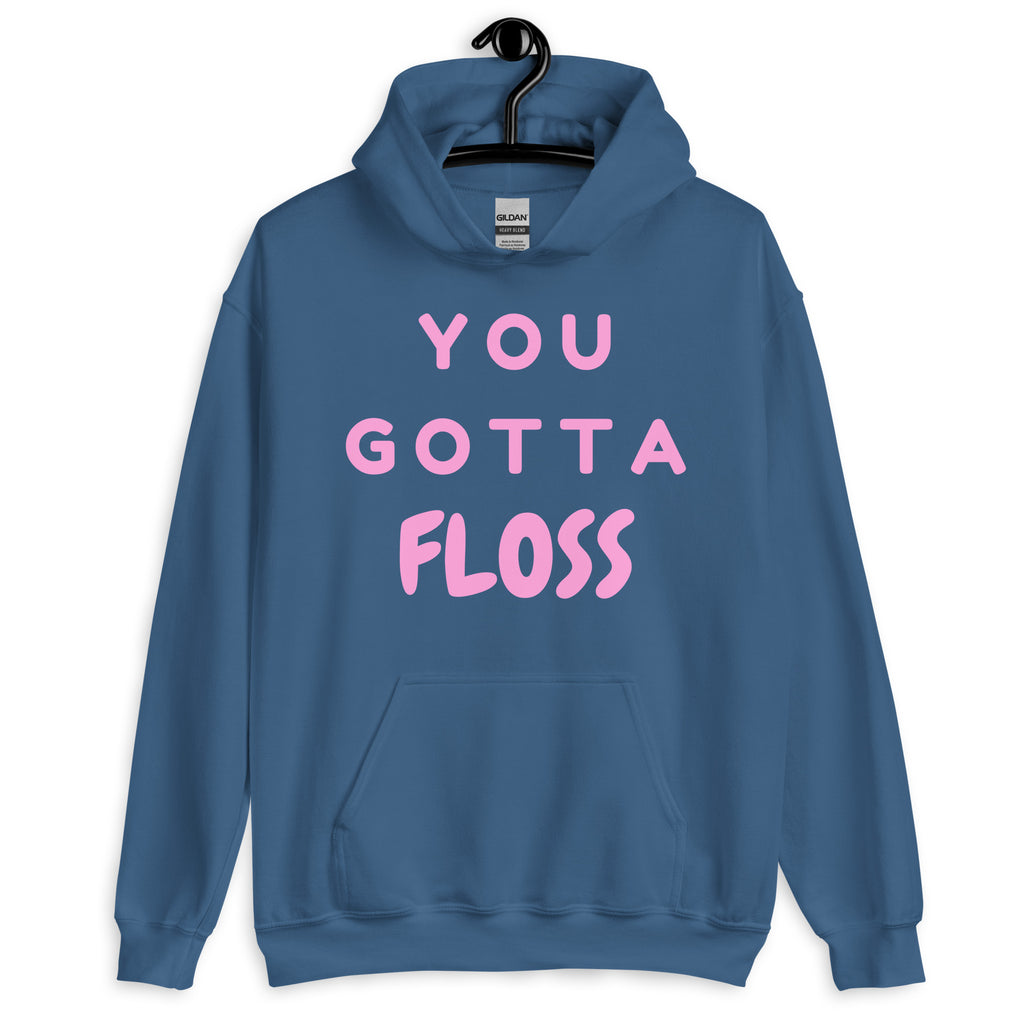 Front view of a blue pullover hoodie with pink “YOU GOTTA FLOSS” lettering