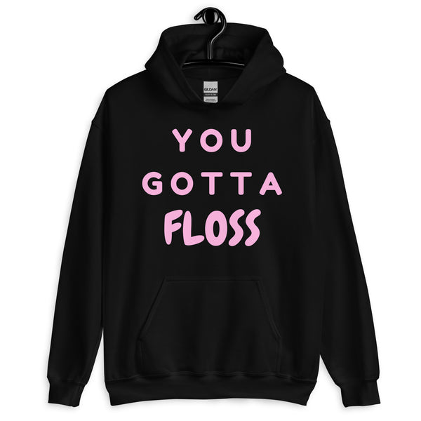 Front view of a black pullover hoodie with pink “YOU GOTTA FLOSS” lettering