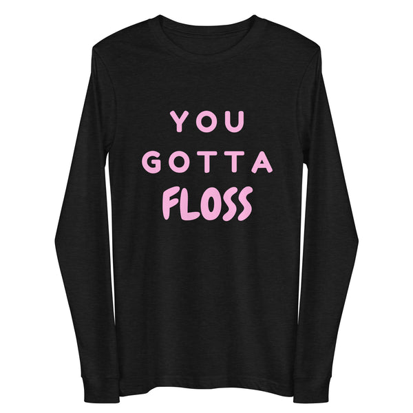 Front view of a black long-sleeve shirt with pink “YOU GOTTA FLOSS” lettering
