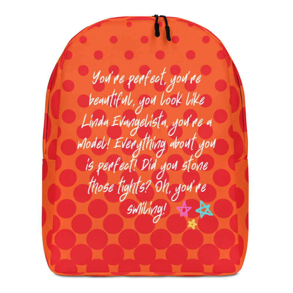 Front view of an orange backpack with red dots and white script text about Linda Evangelista