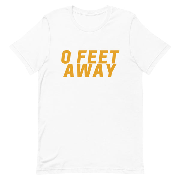 Front view of a white T-shirt with bold orange text reading “0 FEET AWAY”