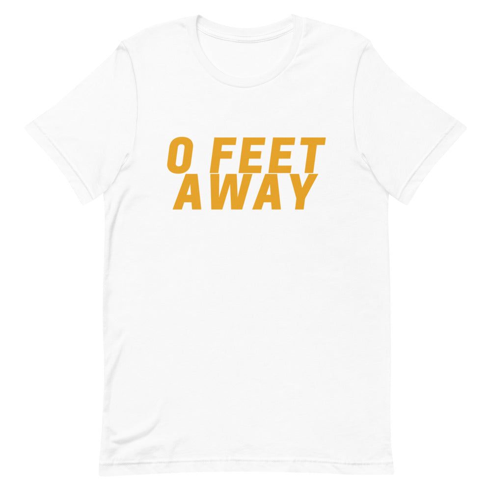 Front view of a white T-shirt with bold orange text reading “0 FEET AWAY”